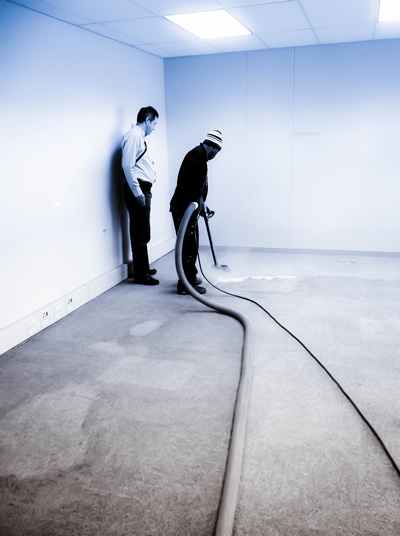 Image depicting the SRT Team deep steam cleaning a carpet, showcasing their expert cleaning services.