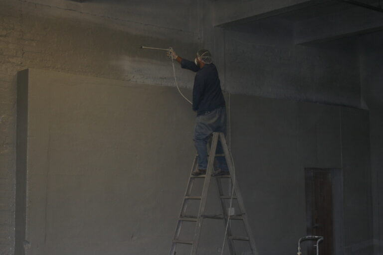 In this image, an SRT employee is seen diligently painting the walls of an office space, aiming to rejuvenate its appearance. With precision and expertise, they apply a fresh coat of paint, enhancing the ambiance and aesthetics of the workspace. Through SRT's dedicated painting services, clients can expect a revitalized environment that fosters productivity and creativity.